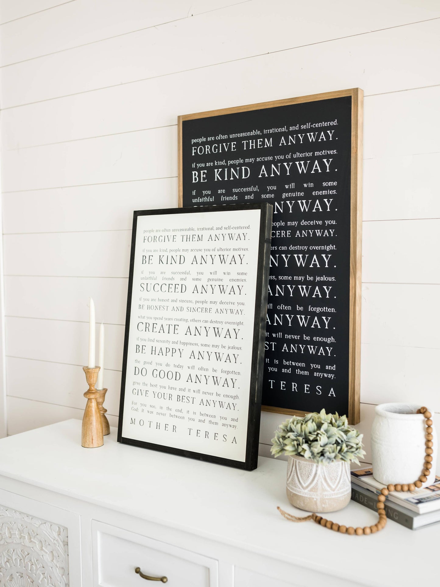 Love them Anyway | Mother Teresa | Wall Art: Soft White-Black Text / Light Brown Frame / 16 inches x 24 inches