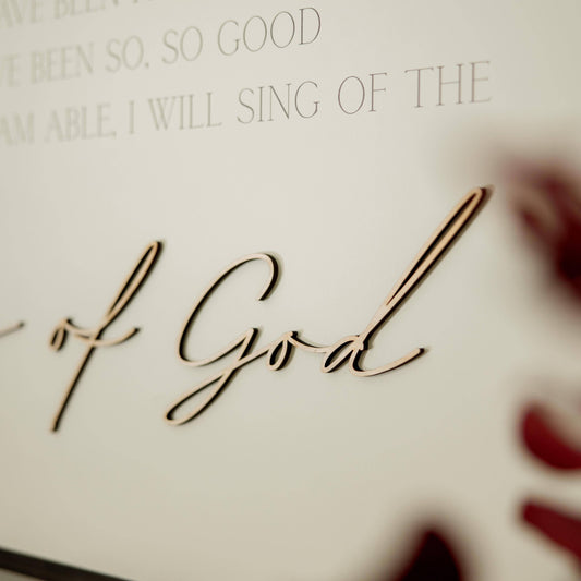 Goodness of God: Soft White-Black Text / Light Brown Frame / 45 inches by 23 inches