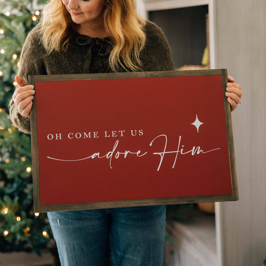 Let Us Adore Him: Red-White Text / Dark Brown Frame / 24 inches x 16 inches
